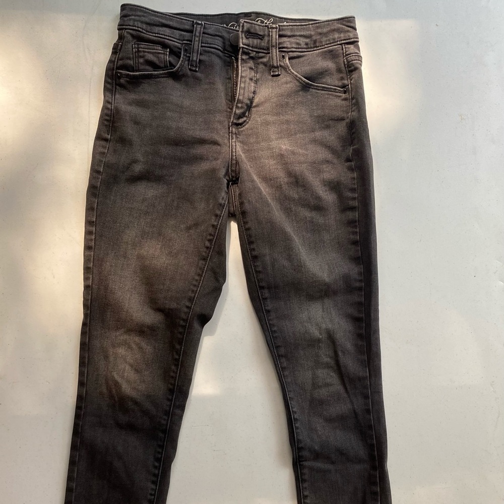 Women’s faded black high rise skinny denim jeans